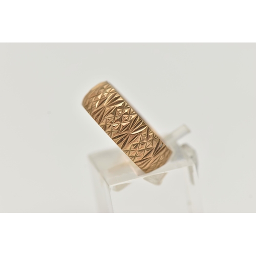 37 - A 9CT YELLOW GOLD RING, designed as a textured band, measuring approximately 7.0mm wide, hallmarked ... 