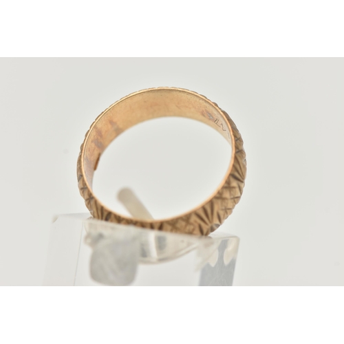 37 - A 9CT YELLOW GOLD RING, designed as a textured band, measuring approximately 7.0mm wide, hallmarked ... 