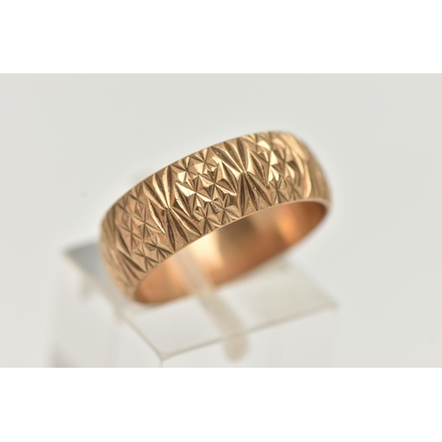 37 - A 9CT YELLOW GOLD RING, designed as a textured band, measuring approximately 7.0mm wide, hallmarked ... 