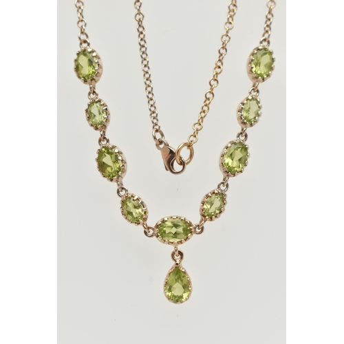 50 - A YELLOW METAL PERIDOT NECKLACE, designed as a row of nine oval cut peridots, each in a claw setting... 