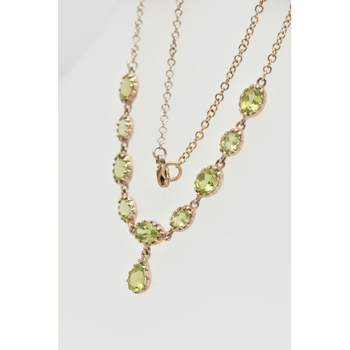 50 - A YELLOW METAL PERIDOT NECKLACE, designed as a row of nine oval cut peridots, each in a claw setting... 