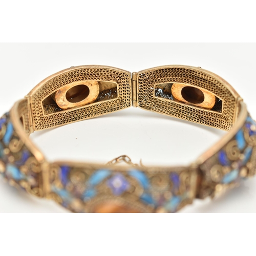 58 - A GEMSET BRACELET, comprised of five domed panels with filigree and enamel detail, each panel set wi... 