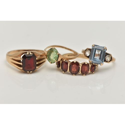 8 - FOUR GEM SET RINGS, the first a five stone oval cut garnet ring, prong set in yellow gold, hallmarke... 