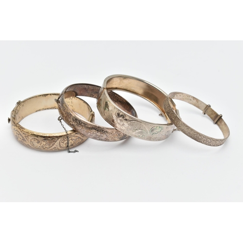 80 - FOUR BANGLES, to include two silver foliage pattern hinged bangles, both fitted with push button cla... 