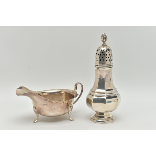 105 - AN ELIZABETH II SILVER SAUCE BOAT AND A GEORGE V SUGAR CASTER, the polished sauce boat with wavy rim... 