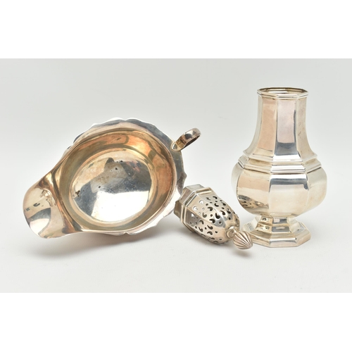 105 - AN ELIZABETH II SILVER SAUCE BOAT AND A GEORGE V SUGAR CASTER, the polished sauce boat with wavy rim... 