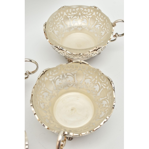 114 - A GEORGE VI SILVER AND FROSTED GLASS LINED DESSERT SET, comprising a fruit bowl and six dishes, each... 