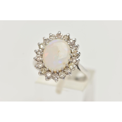 141 - AN OPAL AND DIAMOND CLUSTER RING, designed as a central oval opal cabochon within a single cut diamo... 