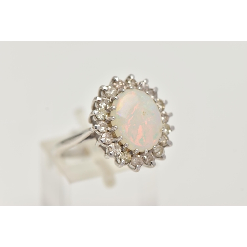 141 - AN OPAL AND DIAMOND CLUSTER RING, designed as a central oval opal cabochon within a single cut diamo... 