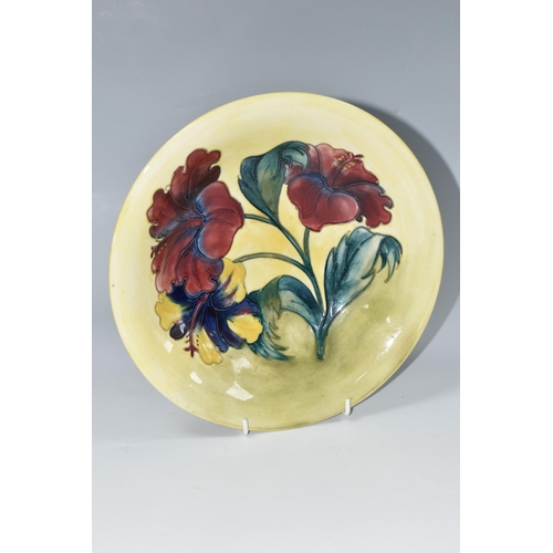 353 - A MOORCROFT POTTERY HIBISCUS VASE, the footed bowl in 'Hibiscus' pattern on a yellow green ground, p... 