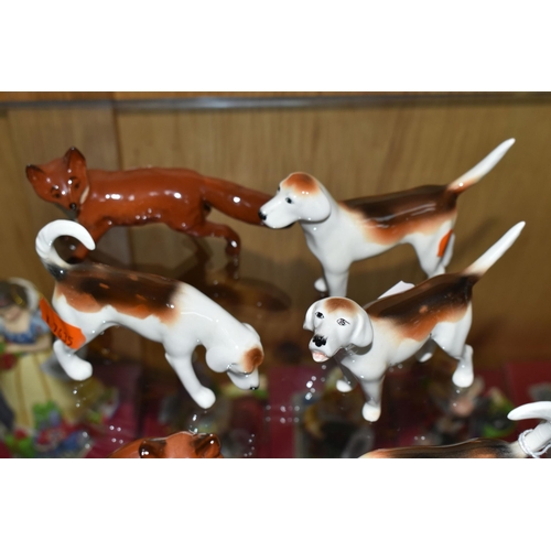 359 - A GROUP OF BESWICK FOXES AND FOXHOUNDS, comprising Foxhounds model nos 941, 942, 943 and 944, and tw... 