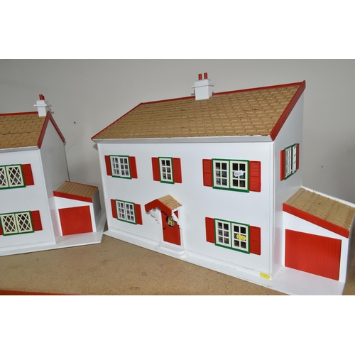 365 - TWO WOODEN DOLL'S HOUSES, modelled as a detached house with side garage, front opening, no furniture... 