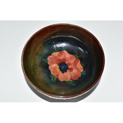 403 - A MOORCROFT POTTERY FLAMBÉ BOWL, the footed bowl in the Anemone pattern on a red/green/blue ground, ... 