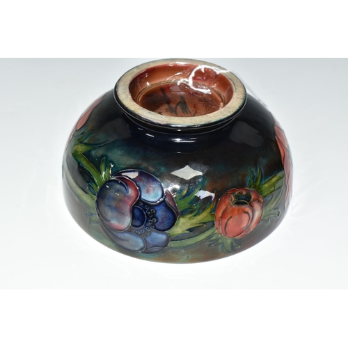 403 - A MOORCROFT POTTERY FLAMBÉ BOWL, the footed bowl in the Anemone pattern on a red/green/blue ground, ... 