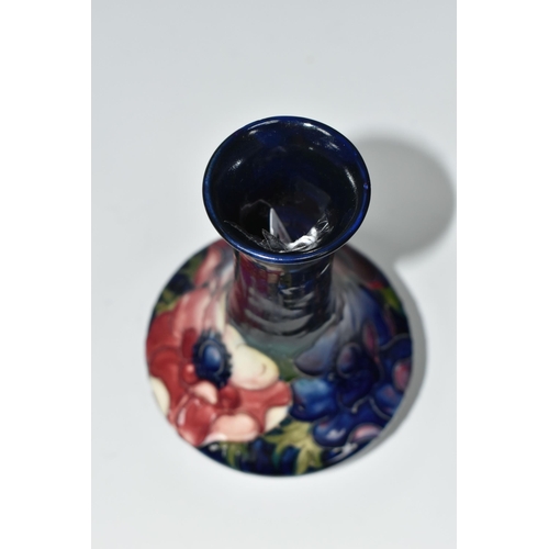 404 - A MOORCROFT POTTERY VASE, tube lined in Anemone pattern on a cobalt blue ground, impressed and paint... 