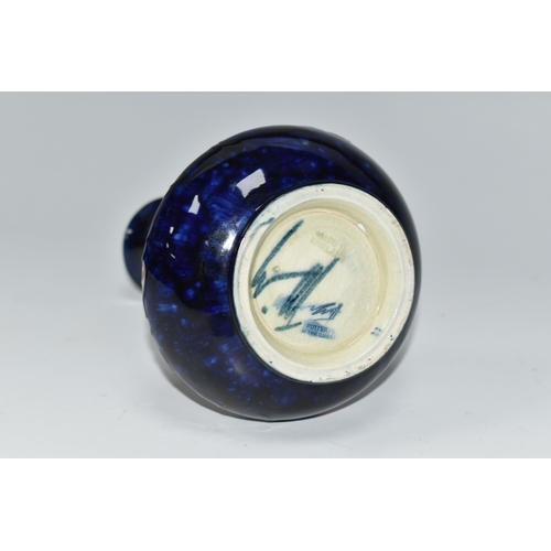 404 - A MOORCROFT POTTERY VASE, tube lined in Anemone pattern on a cobalt blue ground, impressed and paint... 