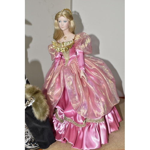 416 - FOUR PORCELAIN COLLECTOR'S DOLLS, Franklin Heirloom Dolls supported by stands, comprising Rapunzel b... 