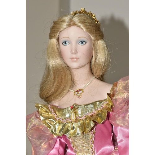 416 - FOUR PORCELAIN COLLECTOR'S DOLLS, Franklin Heirloom Dolls supported by stands, comprising Rapunzel b... 