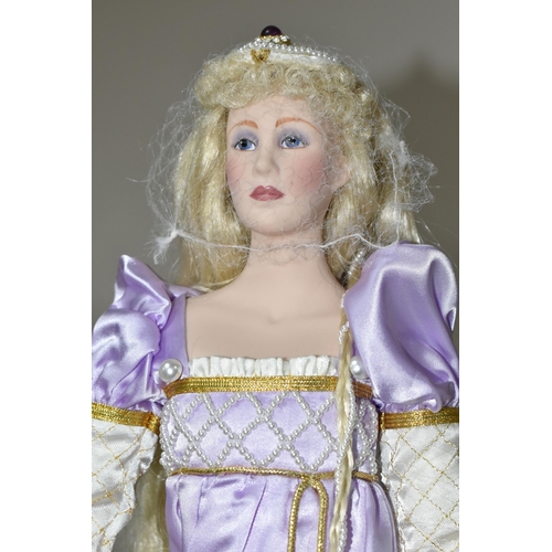 416 - FOUR PORCELAIN COLLECTOR'S DOLLS, Franklin Heirloom Dolls supported by stands, comprising Rapunzel b... 