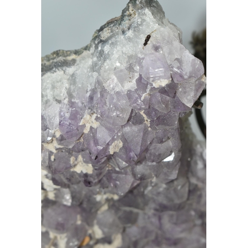 430 - AN AMETHYST CRYSTAL CLUSTER GEODE, supported by a metal display stand with original Harrod's store l... 