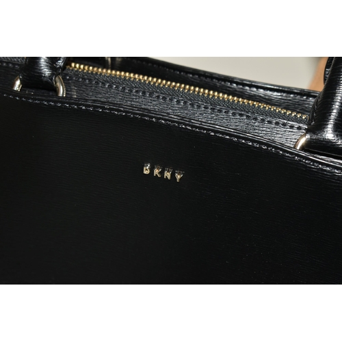 442 - TWO DESIGNER HANDBAGS, comprising a black DKNY handbag with detachable shoulder strap and DKNY bag c... 