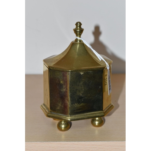 460 - A BRASS TOBACCO JAR, with cover, the jar of octagonal form supported on four feet, height to top of ... 