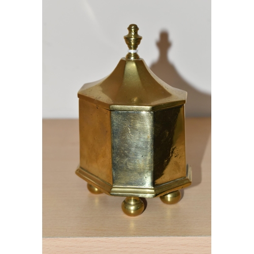 460 - A BRASS TOBACCO JAR, with cover, the jar of octagonal form supported on four feet, height to top of ... 