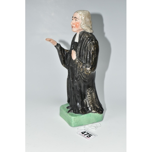 475 - AN EARLY 19TH CENTURY STAFFORDSHIRE PEARLWARE FIGURE OF REV. JOHN WESLEY STANDING WITH ONE ARM RAISE... 