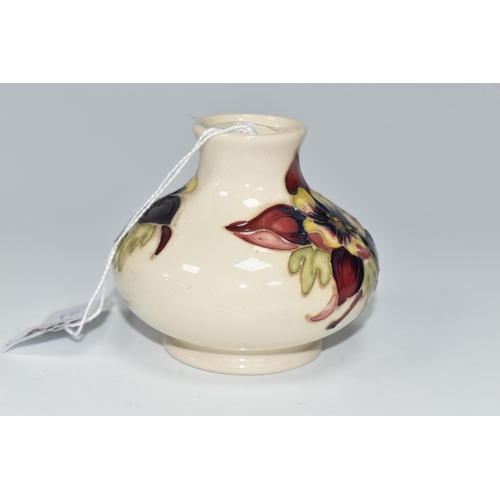 484 - A MOORCROFT POTTERY SQUAT COLUMBINE VASE, tube lined with purple, red and yellow columbine flowers o... 