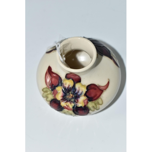 484 - A MOORCROFT POTTERY SQUAT COLUMBINE VASE, tube lined with purple, red and yellow columbine flowers o... 