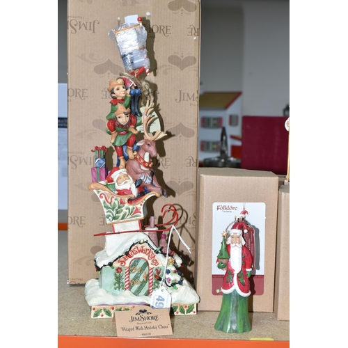 496 - EIGHT BOXED JIM SHORE RESIN CHRISTMAS FIGURES, comprising two 'Heaped with Holiday' sculptures of Sa... 