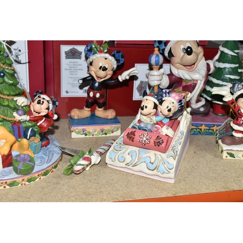 497 - SIX BOXED ENESCO 'DISNEY TRADITIONS' SCULPTURES, comprising 'Here comes Old St Mick', 'Merry tree tr... 