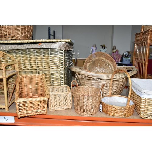 515 - A COLLECTION OF WICKER BASKETS, to include laundry baskets, hamper, a two tier stand, baskets with a... 