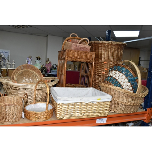 515 - A COLLECTION OF WICKER BASKETS, to include laundry baskets, hamper, a two tier stand, baskets with a... 