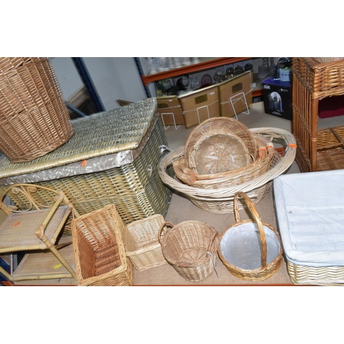 515 - A COLLECTION OF WICKER BASKETS, to include laundry baskets, hamper, a two tier stand, baskets with a... 