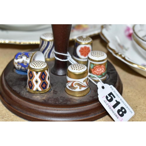 518 - A GROUP OF ROYAL CROWN DERBY DINNER, TEA AND GIFT WARES, comprising a wooden stand holding six diffe... 