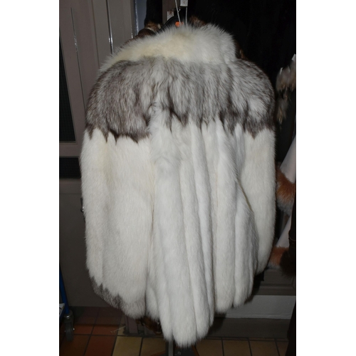 536 - A GROUP OF THREE LADIES FUR COATS, to include a white Arctic fox fur jacket with detailed  brown tip... 