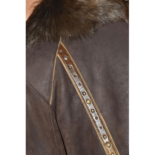 537 - A SUEDE CAPE WITH FUR COLLAR AND BROWN LEATHER LADIES SHEEPSKIN, comprising an apricot coloured sued... 