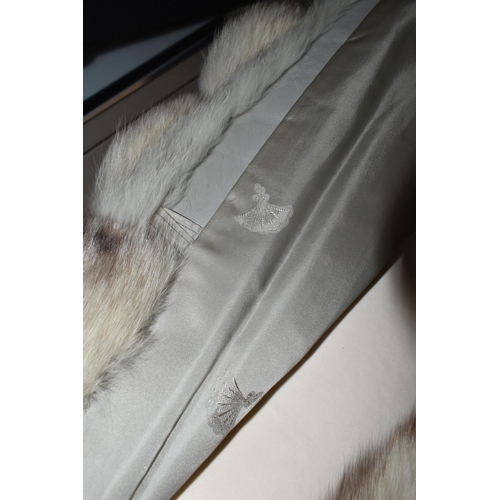 538 - TWO LADIES LONG FUR COATS, comprising a cream and brown tipped Artic fox fur coat with pale grey lea... 