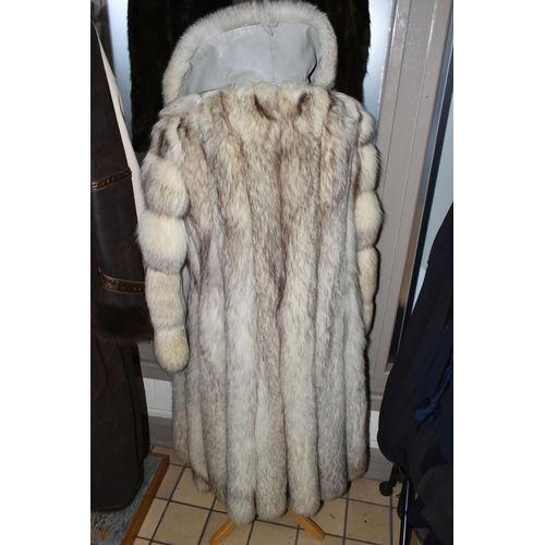 538 - TWO LADIES LONG FUR COATS, comprising a cream and brown tipped Artic fox fur coat with pale grey lea... 