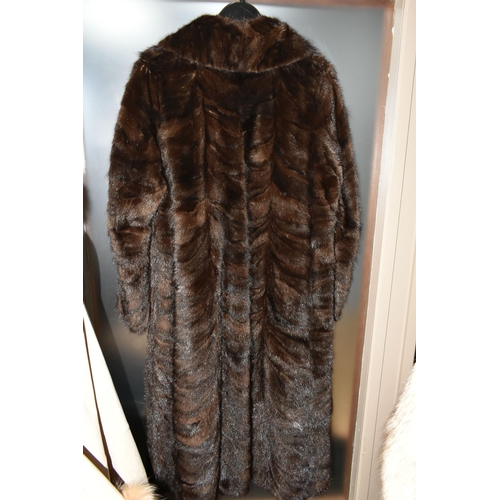 538 - TWO LADIES LONG FUR COATS, comprising a cream and brown tipped Artic fox fur coat with pale grey lea... 