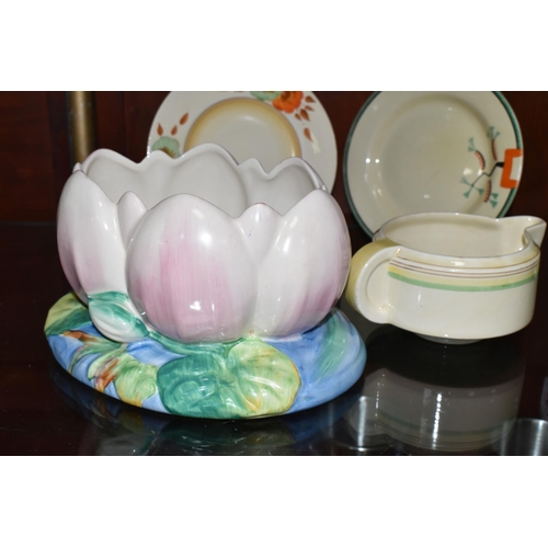 548 - FOUR PIECES OF CLARICE CLIFF CERAMICS, comprising a Newport Pottery pale pink Water Lily jardiniere ... 