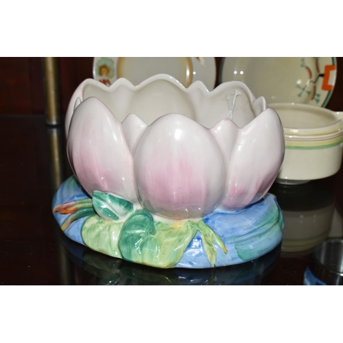 548 - FOUR PIECES OF CLARICE CLIFF CERAMICS, comprising a Newport Pottery pale pink Water Lily jardiniere ... 