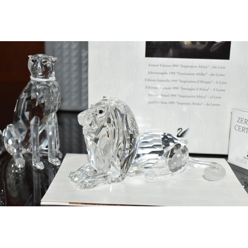 553 - TWO BOXED SWAROVSKI CRYSTAL CHEETAH AND LION FIGURES, comprising Cheetah (variation 2 with higher se... 
