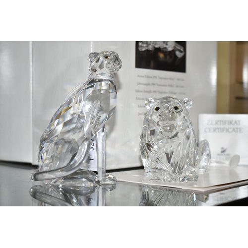 553 - TWO BOXED SWAROVSKI CRYSTAL CHEETAH AND LION FIGURES, comprising Cheetah (variation 2 with higher se... 