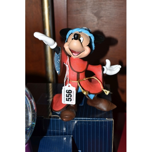 556 - BOXED ENESCO DISNEY SHOWCASE COLLECTION MICKEY MOUSE FANTASIA SNOW GLOBE AND FIGURE, comprising a So... 