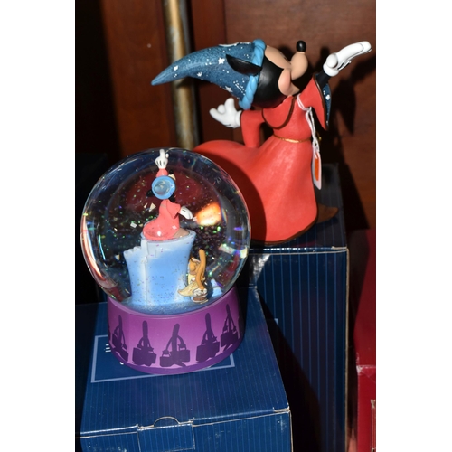 556 - BOXED ENESCO DISNEY SHOWCASE COLLECTION MICKEY MOUSE FANTASIA SNOW GLOBE AND FIGURE, comprising a So... 