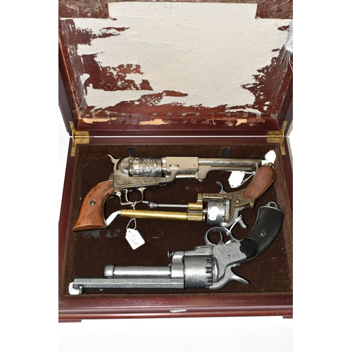 285 - THREE WHITE METAL REPLICA REVOLVERS, designed so they are incapable of conversion to fire live cartr... 