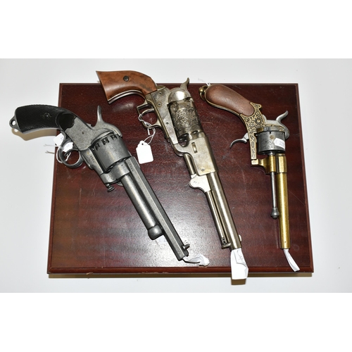 285 - THREE WHITE METAL REPLICA REVOLVERS, designed so they are incapable of conversion to fire live cartr... 