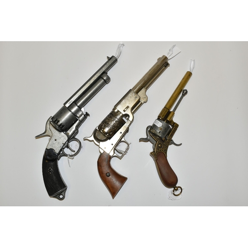 285 - THREE WHITE METAL REPLICA REVOLVERS, designed so they are incapable of conversion to fire live cartr... 